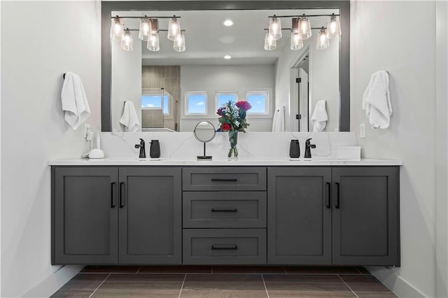 bathroom with vanity and walk in shower