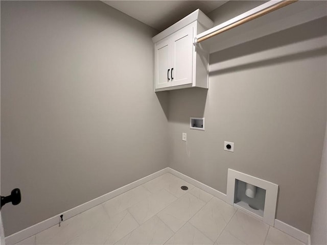 washroom with cabinets, hookup for an electric dryer, and hookup for a washing machine