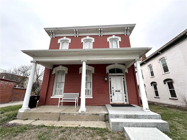 italianate-style house featuring covered porch