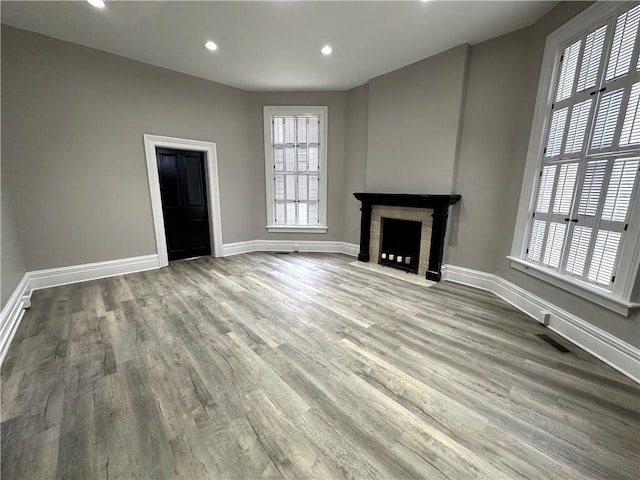 unfurnished living room featuring hardwood / wood-style flooring