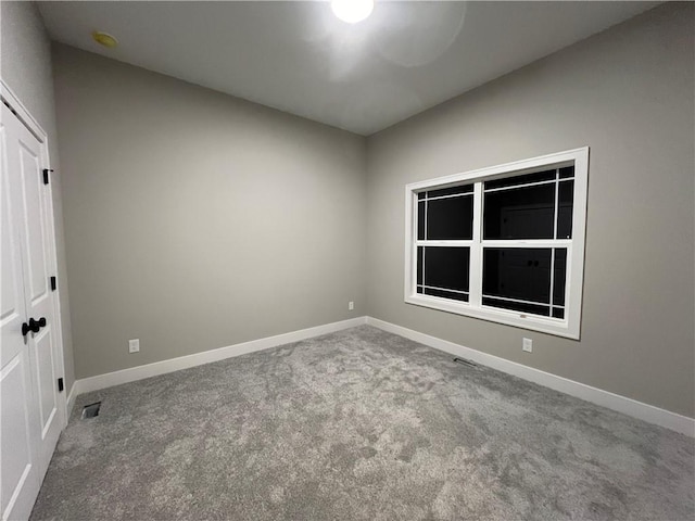 empty room featuring carpet flooring