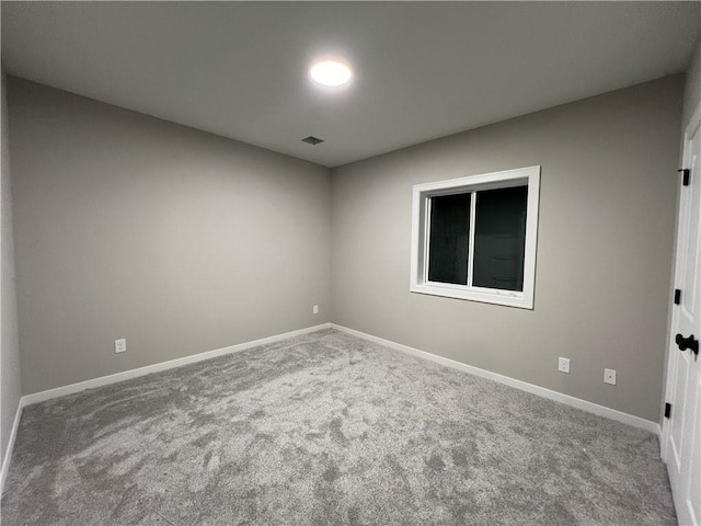 spare room featuring carpet flooring