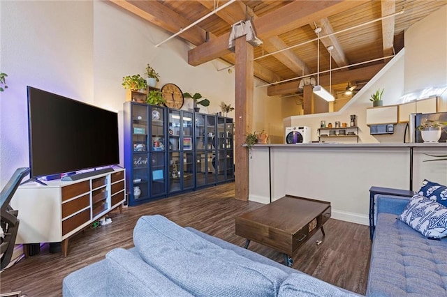 living room featuring washer / dryer, wooden ceiling, beamed ceiling, and wood finished floors