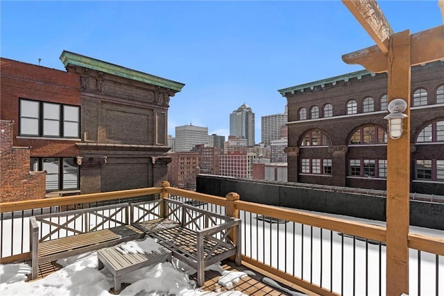 wooden terrace featuring a view of city