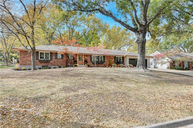 ranch-style home featuring a garage