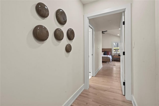 corridor with light wood-type flooring