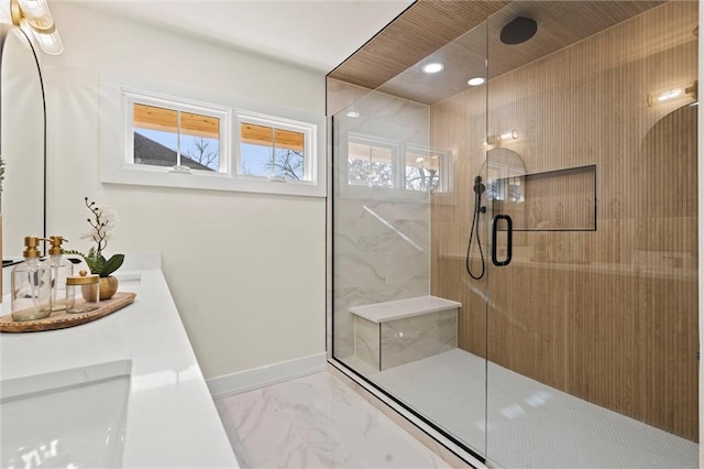 bathroom featuring vanity and a shower with shower door