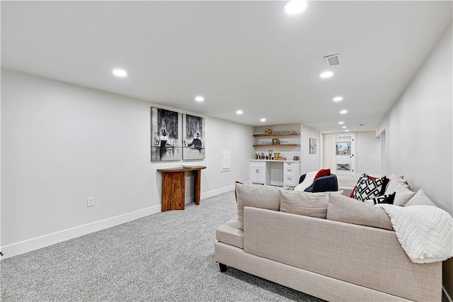 living room featuring indoor bar and carpet floors