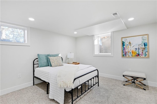 bedroom featuring light colored carpet