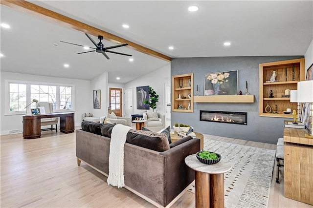 living room featuring ceiling fan, vaulted ceiling with beams, built in features, and light hardwood / wood-style floors