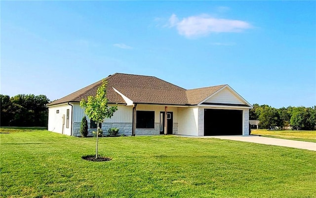 ranch-style home with a garage and a front lawn