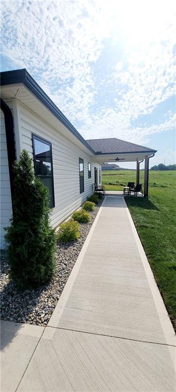 view of side of home featuring a yard