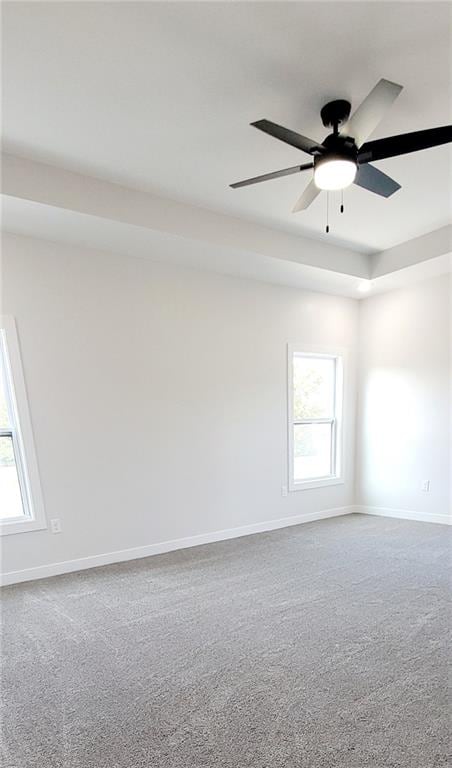 empty room featuring carpet and ceiling fan