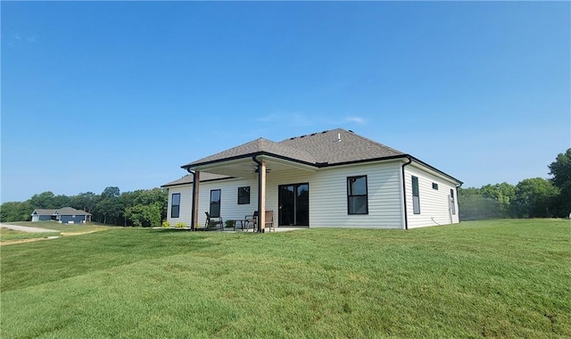 rear view of house with a lawn, ceiling fan, and a patio