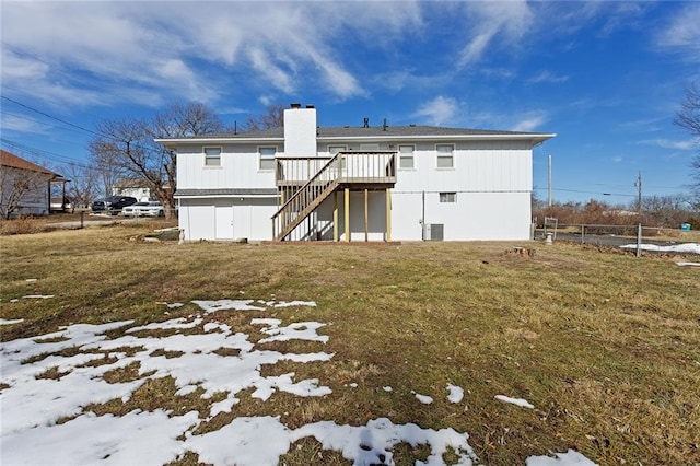 back of house with cooling unit, a yard, and a deck