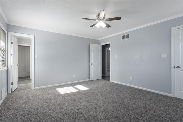 unfurnished bedroom with ornamental molding, carpet, and ceiling fan