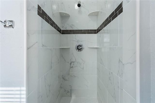 details featuring a tile shower