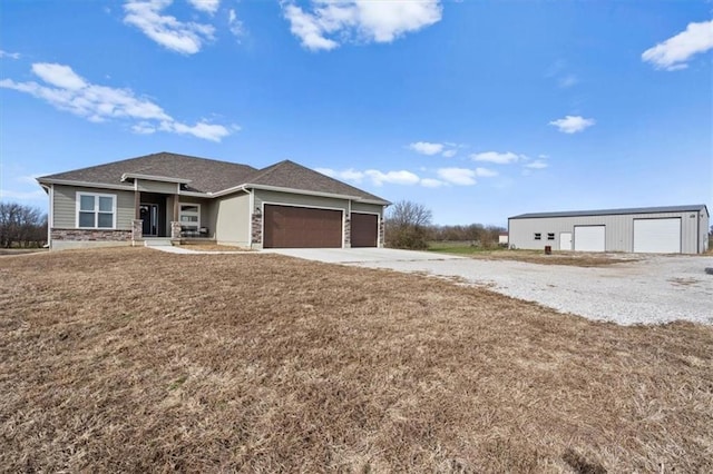 view of front facade with a garage and a front lawn