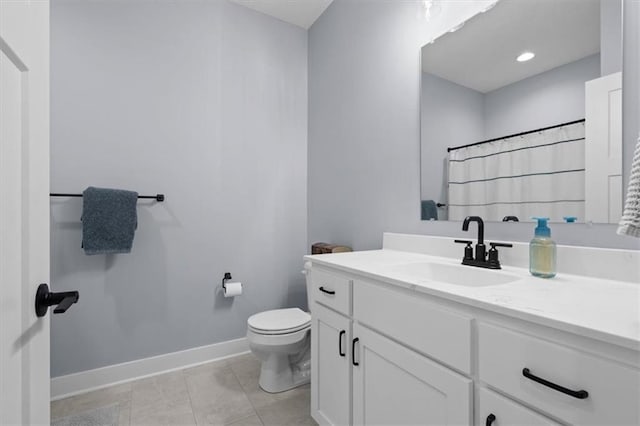 bathroom featuring a shower with curtain, vanity, toilet, and tile patterned floors