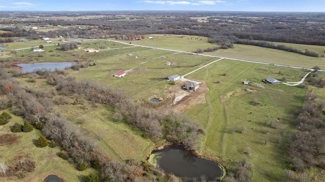 bird's eye view with a water view and a rural view