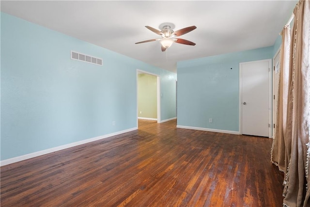 unfurnished room featuring dark hardwood / wood-style flooring and ceiling fan