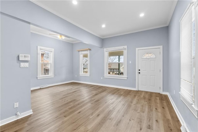 entrance foyer featuring ceiling fan, light hardwood / wood-style floors, and ornamental molding