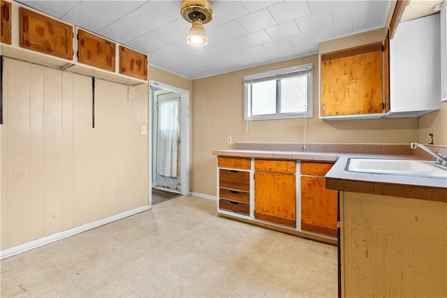 kitchen featuring decorative light fixtures and sink