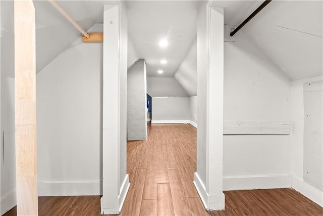 interior space featuring hardwood / wood-style flooring and lofted ceiling