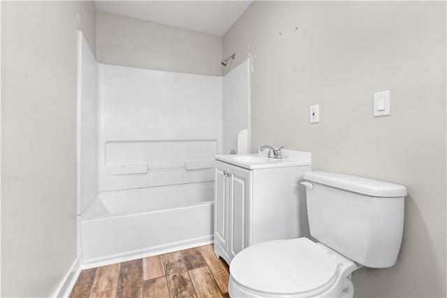 full bathroom featuring shower / washtub combination, toilet, vanity, and hardwood / wood-style flooring