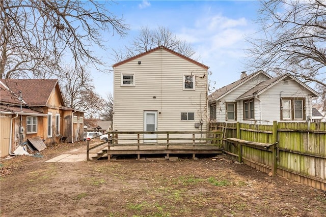 back of house with a wooden deck