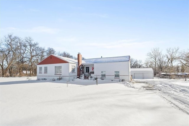 view of snow covered house