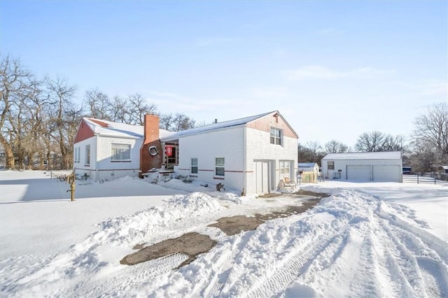 exterior space with an outdoor structure and a garage