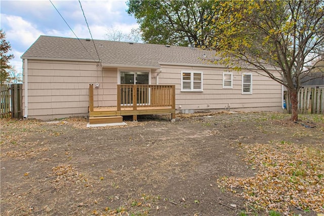 rear view of property with a deck