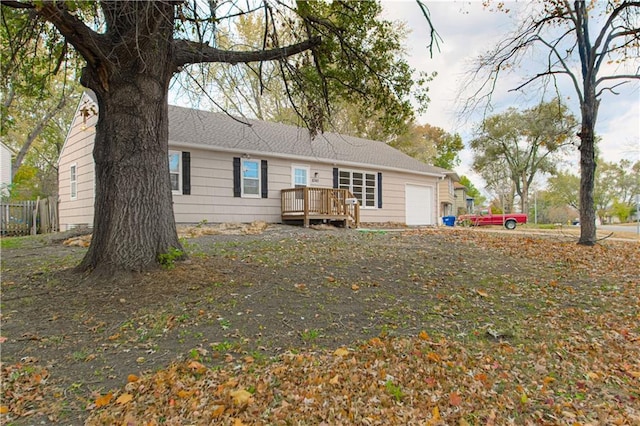 back of house featuring a wooden deck