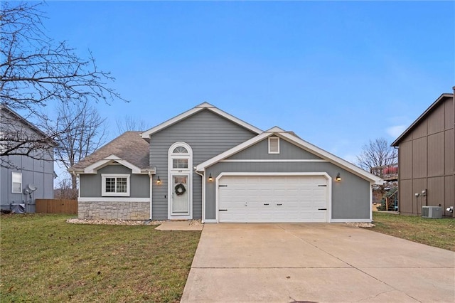 view of front of house with a front yard and a garage