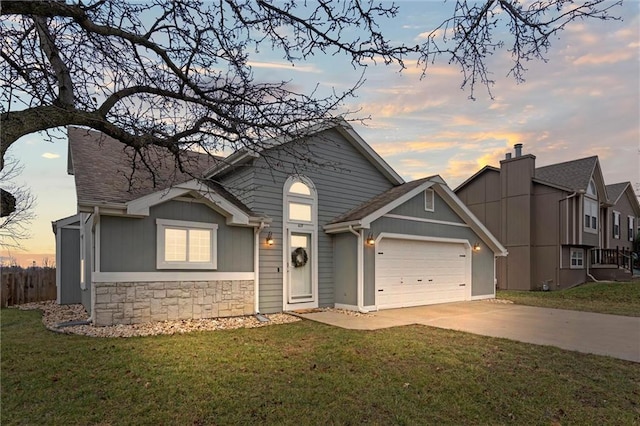 view of front facade featuring a lawn and a garage