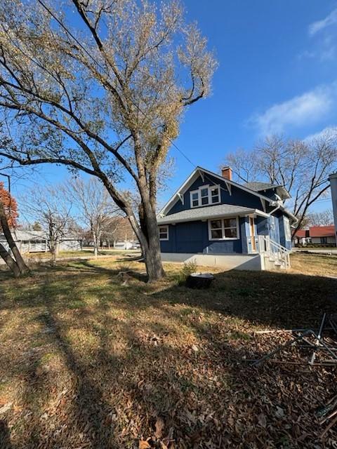 view of property exterior featuring a yard