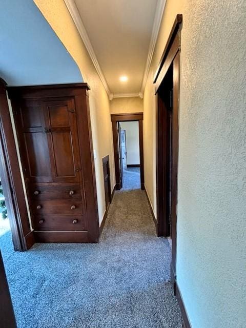 corridor featuring crown molding and light carpet