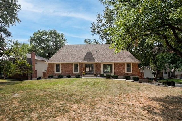 ranch-style home featuring a front yard