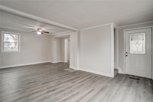 entryway with ceiling fan, light wood-type flooring, and ornamental molding