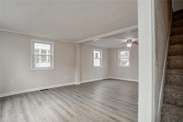 spare room featuring crown molding, light hardwood / wood-style flooring, and ceiling fan