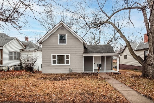 bungalow-style home with a porch and cooling unit