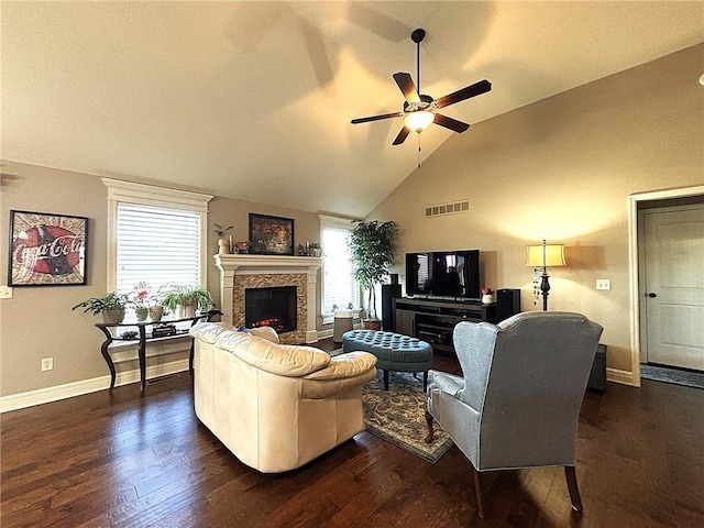 living room with a fireplace, dark hardwood / wood-style floors, ceiling fan, and lofted ceiling