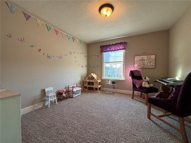 game room featuring carpet flooring and a textured ceiling