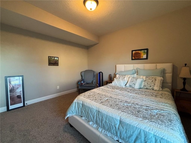 carpeted bedroom featuring a textured ceiling