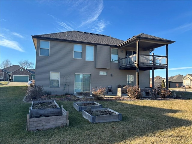 rear view of property featuring a balcony and a lawn