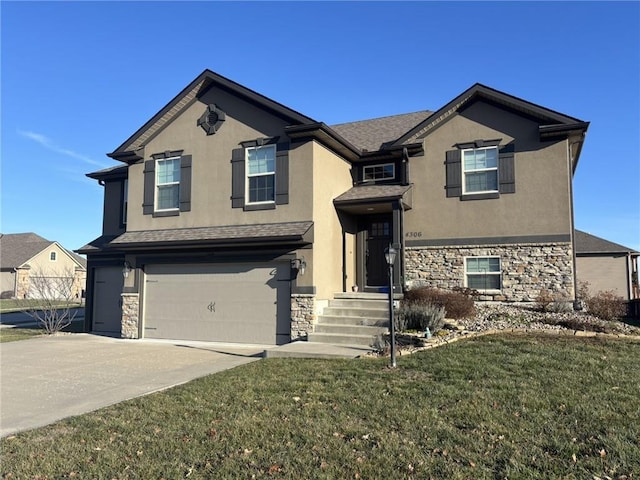 view of front of property featuring a front yard and a garage