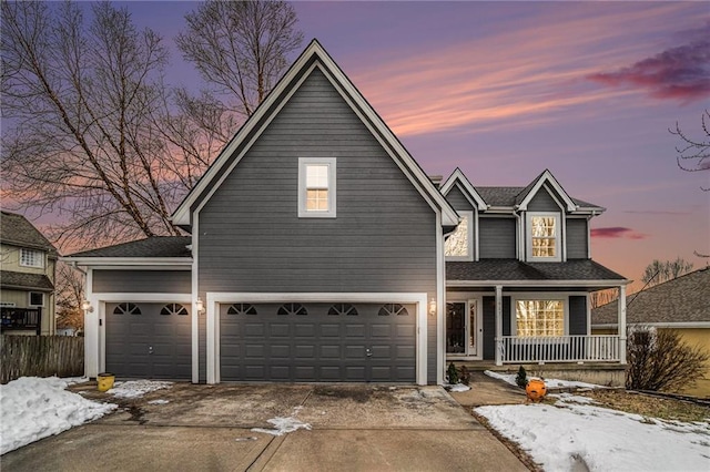 view of front property featuring a garage and covered porch