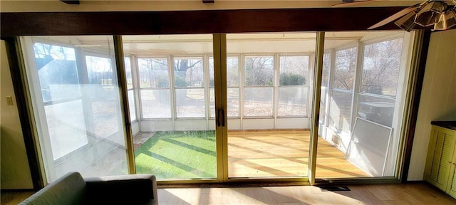 entryway with hardwood / wood-style flooring