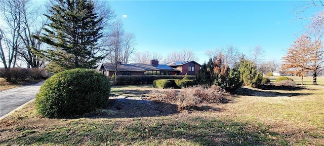 view of home's exterior with a yard